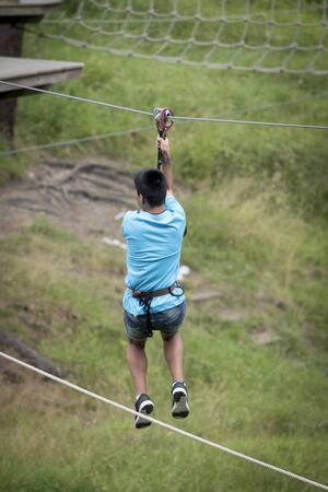 Zipline in an adventure parkの写真素材