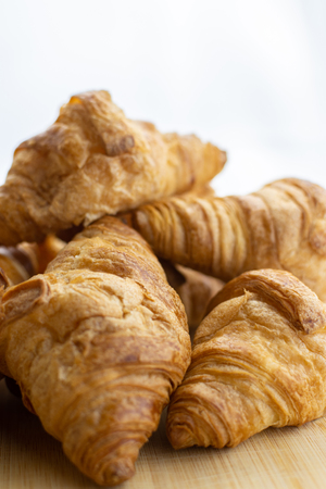 Fresh croissants on white backgroundの写真素材
