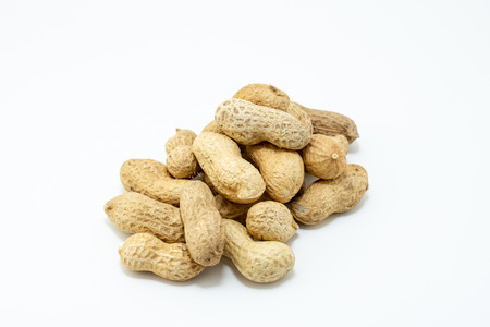 Group of peanuts stacked and isolated on white backgroundの写真素材