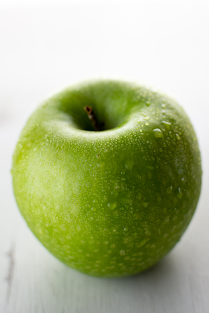 Wet green appleの写真素材
