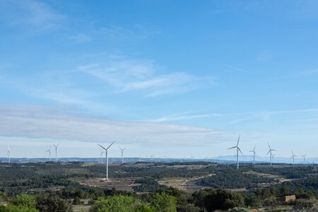 Full view of landscape with windmills