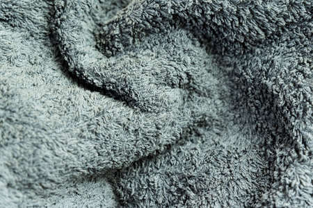 Detail background of a terry towel in gray color. Textured in gray.の写真素材