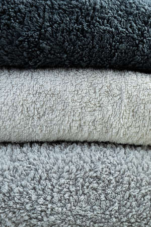 Background of the detail of a terrycloth towels in different shades of gray and white.の写真素材
