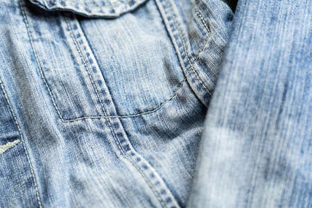 Detail of the pocket of a blue denim jeans. Blue denim jacket.の写真素材