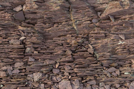 Textured background of pieces of slate stone with gray and brown colors