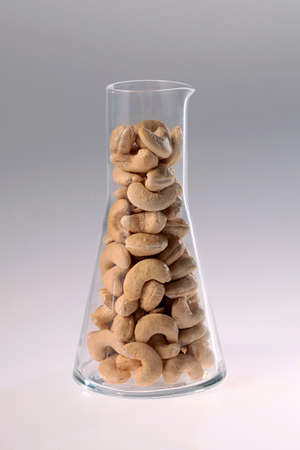 cashew nuts in glass jarの写真素材