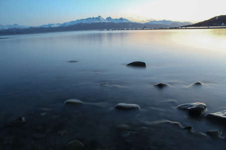 Water reservoir in mountain landscape during sunsetの写真素材