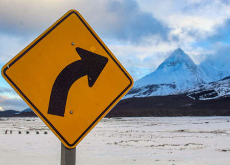 Sign indicating road to the snowy mountainの写真素材