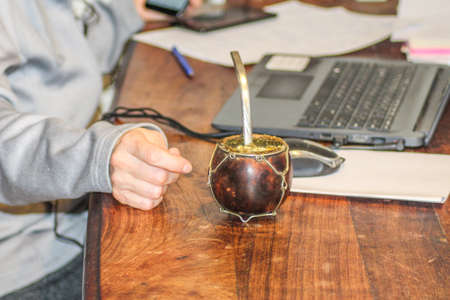 Working from home with a good mate tea as an infusion to drinkの写真素材