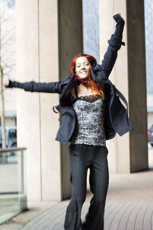 businesswoman jumping up celebrating glorious victoryの写真素材