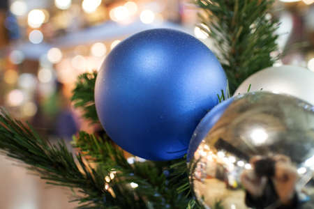 another bright blue ornament on christmas treeの写真素材