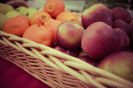 a basket of apples and orangesの写真素材