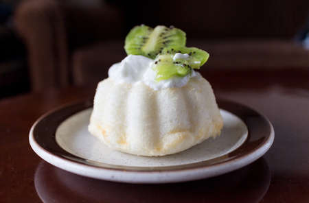 mini angel food cake with kiwi fruit and creamの写真素材