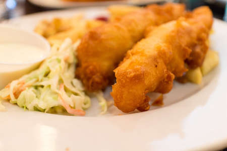 some fish and chips with coleslawの写真素材