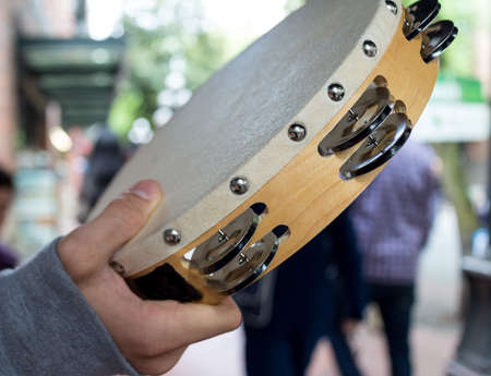 a tambourine shaking on the streetの写真素材