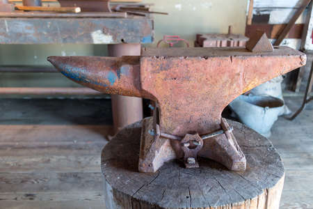 an old anvil in rustic shopの写真素材
