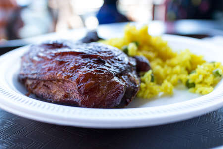a barbecued chicken dinner with riceの写真素材