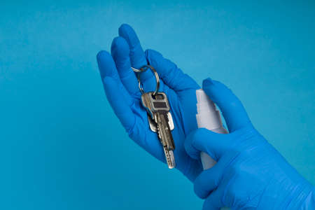 antibacterial protection of domestic objects from coronavirus concept. disinfecting keys with...