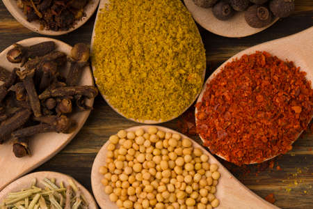 Assortment of powder and seeds spices on spoons. Macro shotの写真素材