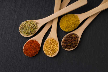Spices on black slate background. Macro shot