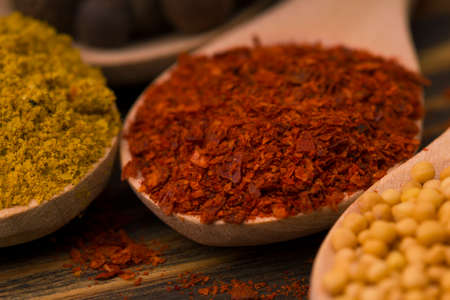 Red Hot Paprika Powder On Wooden Spoonの写真素材