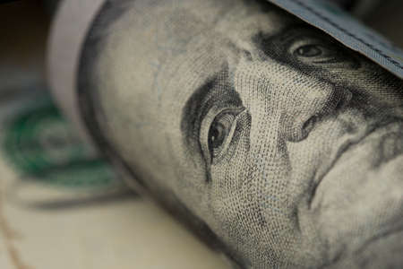Benjamin Franklin portrait rolled up. Close upの写真素材