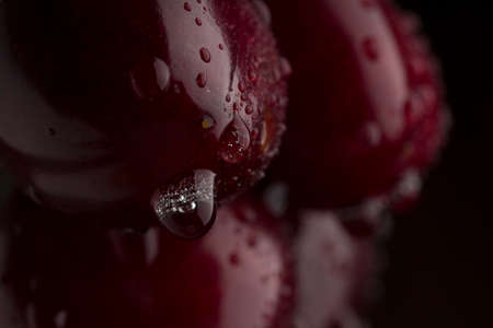 Background from sweet fresh wet red cherry, macro shotの写真素材