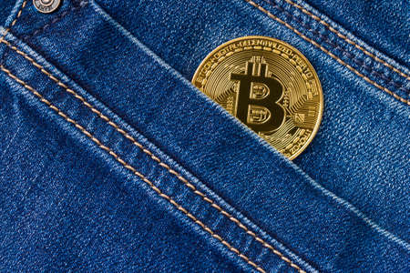 Bitcoin in a jeans pocket., Close up. Virtual money, crypto currencyの写真素材