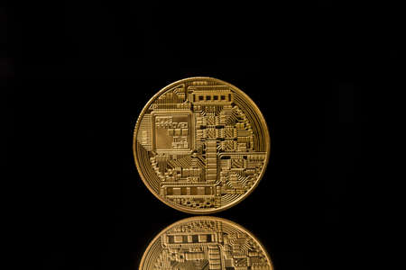 back of bitcoin isolated on black background. ... Physical bit coin. Digital currency. Cryptocurrencyの写真素材