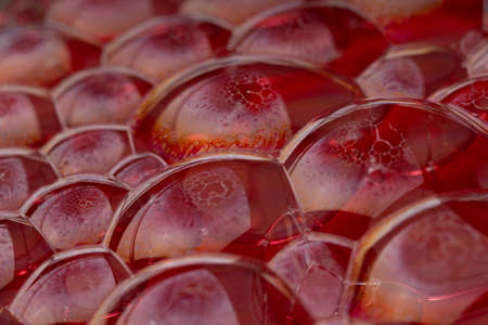 Red Background Of Suds Bubbles. Soft focus. Macroの写真素材