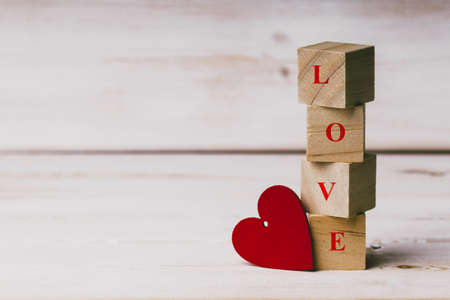 Heart with love sign on wooden cubes.の写真素材