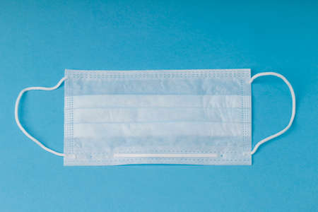 medical mask on a blue background .. Healthcare Backgroundの写真素材