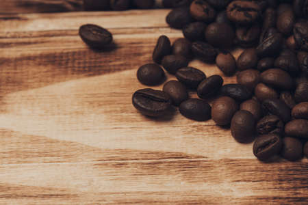Roasted Coffee beans on wood backgroundの写真素材