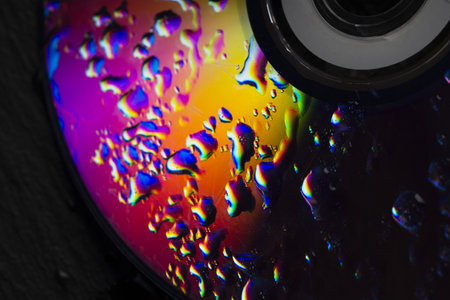 Compact Disc CD with water drops on the data surfaceの写真素材