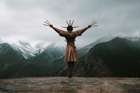 Dance With Daggers monument towering along with high mountain peaks in Verkhny Zgid village. North Ossetia, Russiaのeditorial素材
