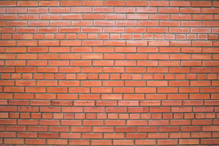 Old red brick wall background, wide angle view. construction site conceptの写真素材