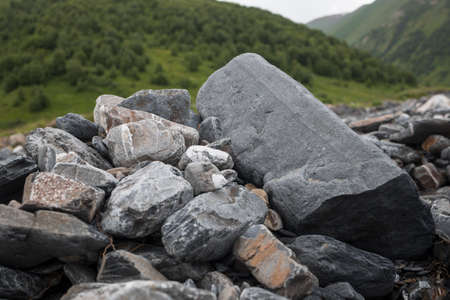 Stone stacked against green mountainの写真素材