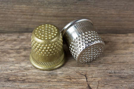 Sewing on the background of the old wooden wallsの写真素材