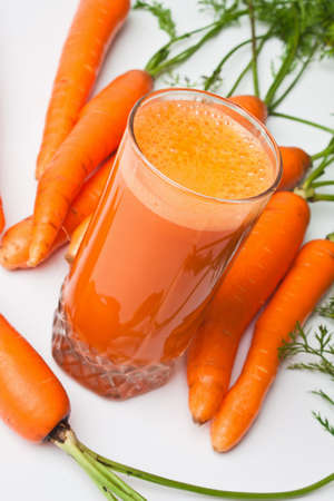 carrots and carrot juice in a glassの写真素材