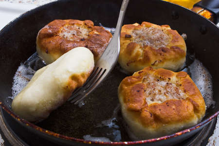 preparation of dough and baking the piesの写真素材