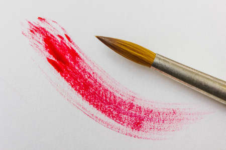 colored paints and brushes for painting on canvas and paperの写真素材