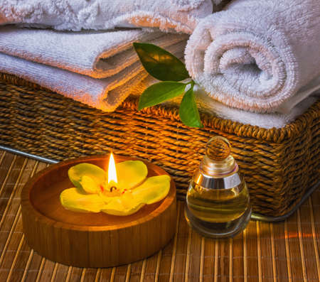Spa with towels with a candle and other accessoriesの写真素材