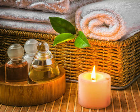 Spa with towels with a candle and other accessoriesの写真素材
