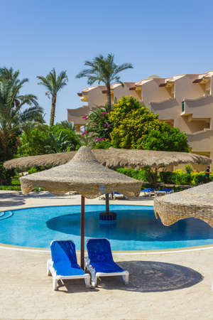 The view from the window of the hotel in Egypt to the pool, sun umbrellas and the Red Seaのeditorial素材