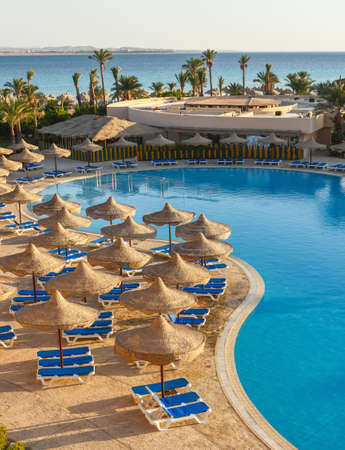The view from the hotel in Egypt to the pool, sun umbrellas and the Red Seaのeditorial素材
