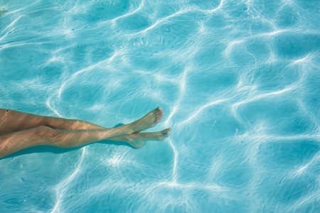 Blue water in the pool on a sunny dayの写真素材