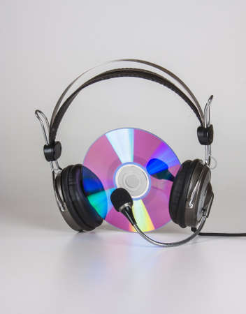 headphones and compact disc on a white backgroundの写真素材