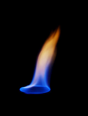 flame on the glass with a cocktail in the dark restaurantの写真素材