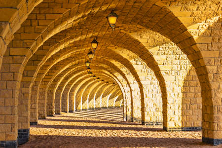 The arched stone colonnade with suspended lanternsの写真素材