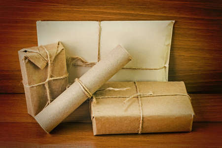 Postage on the background of an old wooden boardの写真素材